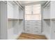 Well-organized walk-in closet with custom shelving, drawers, and storage cabinets at 4880 Hayride St, Las Vegas, NV 89149