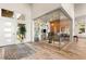 Bright foyer featuring a glass-enclosed office, wood floors, and modern accents at 5184 Steel Hammer Dr, Las Vegas, NV 89135