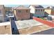 Aerial view of the backyard with large patio, brick fence, and potential for landscaping at 5288 Emelita St, Las Vegas, NV 89122