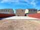 Back view of home featuring a large patio, brick fence, and space for outdoor activities at 5288 Emelita St, Las Vegas, NV 89122