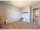 Bedroom with neutral walls, carpet, a view into the hallway, and a small shelf at 5288 Emelita St, Las Vegas, NV 89122