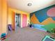 Colorful bedroom featuring a vibrant mural, with space for activities at 5288 Emelita St, Las Vegas, NV 89122