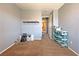 Bedroom featuring neutral walls, carpet, a view into the hallway, and a small shelf at 5288 Emelita St, Las Vegas, NV 89122