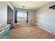 Bedroom with carpet, a window with blinds, and space for storage and decor at 5288 Emelita St, Las Vegas, NV 89122