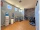 Versatile bonus room featuring wood-look flooring, natural light, and a creative wood wall at 5288 Emelita St, Las Vegas, NV 89122
