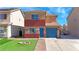 Charming two-story home with blue door and a well-maintained front yard at 5288 Emelita St, Las Vegas, NV 89122