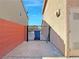 Side yard featuring a small gate access and concrete, perfect for additional storage or easy maintenance at 5288 Emelita St, Las Vegas, NV 89122