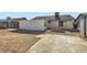 Large backyard with dirt and partial patio at 53 Montello Ave, Las Vegas, NV 89110