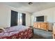 This bedroom features carpet flooring, a window, and dark colored curtains at 53 Montello Ave, Las Vegas, NV 89110