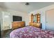 Spacious bedroom featuring carpet flooring, a dresser, and a comfortable bed at 53 Montello Ave, Las Vegas, NV 89110