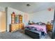 Cozy bedroom featuring soft carpet, dresser, and a comfortable bed at 53 Montello Ave, Las Vegas, NV 89110