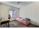 This carpeted bedroom features a large window and neutral wall color at 53 Montello Ave, Las Vegas, NV 89110