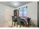 A dining area features a table with four chairs, a window with a view, and tile floors at 53 Montello Ave, Las Vegas, NV 89110