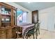 Dining area featuring a table with chairs, tile flooring, and a window with a pleasant view at 53 Montello Ave, Las Vegas, NV 89110