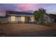 Cozy single-story home featuring desert landscaping and solar panels for energy efficiency at 53 Montello Ave, Las Vegas, NV 89110