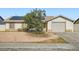 Charming single-story home with gravel landscaping, a covered front porch, and solar panels at 53 Montello Ave, Las Vegas, NV 89110