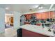 Traditional kitchen featuring wood cabinets, stainless steel appliances, and tile flooring at 53 Montello Ave, Las Vegas, NV 89110