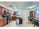 Bright kitchen showcasing stainless steel appliances, tile flooring, and a cozy dining area at 53 Montello Ave, Las Vegas, NV 89110