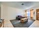 Inviting living room featuring a comfortable carpet and tile flooring with ample natural light at 53 Montello Ave, Las Vegas, NV 89110