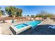 Backyard featuring a rectangular pool with a spa and a well-manicured landscape at 6094 S Lamb Blvd, Las Vegas, NV 89120