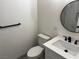 Bathroom featuring tile flooring, a modern vanity, toilet, and a sleek black towel rack at 6117 Iris Cir, Las Vegas, NV 89107