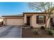 Charming single-story home with a two-car garage, a well-kept front yard, and appealing architectural details at 617 Abrazar Ave, North Las Vegas, NV 89081
