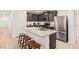 Well-equipped kitchen with stainless steel appliances, granite countertops, and ample cabinet space at 617 Abrazar Ave, North Las Vegas, NV 89081