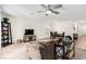 Spacious living room featuring carpet flooring, white walls, and views of the dining area at 617 Abrazar Ave, North Las Vegas, NV 89081