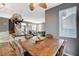 Dining room featuring a wooden table, decorative chairs, and a view into the kitchen area at 6254 Peach Orchard Rd, Las Vegas, NV 89142