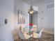 Cozy dining area with a modern light fixture and seating for four at 7111 S Durango Dr # 305, Las Vegas, NV 89113