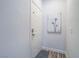 Entry hallway with neutral walls, an art print and modern, secure door at 7111 S Durango Dr # 305, Las Vegas, NV 89113