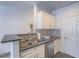 The kitchen features stainless steel appliances and ample counter space at 7111 S Durango Dr # 305, Las Vegas, NV 89113
