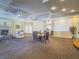 Spacious living room featuring a fireplace, modern lighting and comfortable seating arrangement for relaxation at 7111 S Durango Dr # 305, Las Vegas, NV 89113