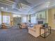 Comfortable living room with a fireplace, comfortable seating and a community map board at 7111 S Durango Dr # 305, Las Vegas, NV 89113
