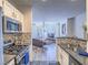 The living room flows from kitchen with modern fireplace and lots of natural light at 7111 S Durango Dr # 305, Las Vegas, NV 89113
