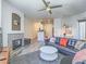 Open living room with a stylish fireplace, comfortable seating, and dining area at 7111 S Durango Dr # 305, Las Vegas, NV 89113
