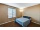 Bedroom featuring wood floors, a large window, and neutral paint at 8452 Boseck Dr # 110, Las Vegas, NV 89145