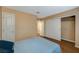 Bedroom with wood floors, closet with sliding doors, and access to other rooms at 8452 Boseck Dr # 110, Las Vegas, NV 89145