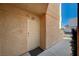 Welcoming entryway with unit number and contemporary design at 8452 Boseck Dr # 110, Las Vegas, NV 89145