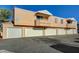 Apartment building featuring garages and private balconies at 8452 Boseck Dr # 110, Las Vegas, NV 89145
