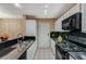 Well-lit kitchen featuring stainless steel appliances and ample counter space at 8452 Boseck Dr # 110, Las Vegas, NV 89145