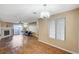 Spacious living room with wood flooring, fireplace, and bright natural light at 8452 Boseck Dr # 110, Las Vegas, NV 89145