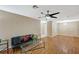 Open living room with ceiling fan, wood floors and fireplace at 8452 Boseck Dr # 110, Las Vegas, NV 89145
