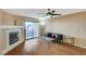 Comfortable living room featuring a fireplace and sliding glass doors at 8452 Boseck Dr # 110, Las Vegas, NV 89145