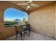 Relaxing covered patio area with outdoor seating and neighborhood views at 8452 Boseck Dr # 110, Las Vegas, NV 89145