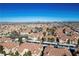 Expansive aerial view of a Las Vegas community showcasing well-maintained homes and distant city skyline at 8501 W University Ave # 2020, Las Vegas, NV 89147