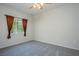 Clean, carpeted bedroom with a window and neutral tones at 8501 W University Ave # 2020, Las Vegas, NV 89147
