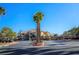 Well-manicured community entrance gate with lush landscaping and secure access for residents and guests at 8501 W University Ave # 2020, Las Vegas, NV 89147