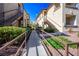Exterior walkway with well-manicured landscaping and railings at 8501 W University Ave # 2020, Las Vegas, NV 89147