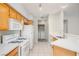 Efficient kitchen with modern appliances and a view into the laundry area at 8501 W University Ave # 2020, Las Vegas, NV 89147